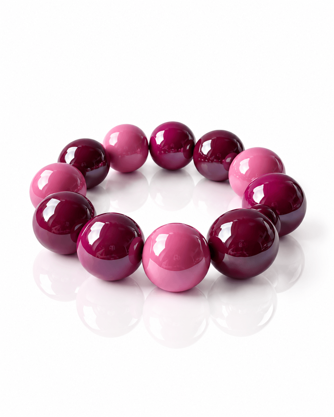 Elastisches THE GLOSSY Pink Sorbet Armband von CASA Pari mit großen glänzenden Resin-Perlen in Pink und dunklen Beerentöne