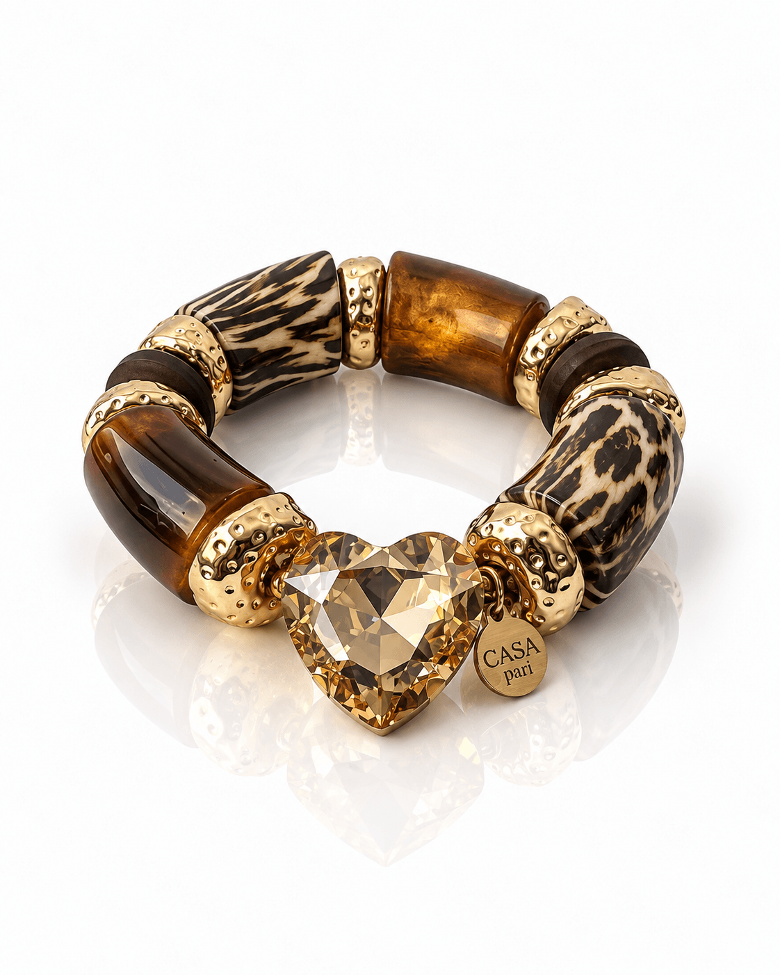 Crystal Heart Armband Wild Cognac mit braunen und gemusterten Perlen, goldfarbenen Details und großem champagnerfarbenem Herzstein