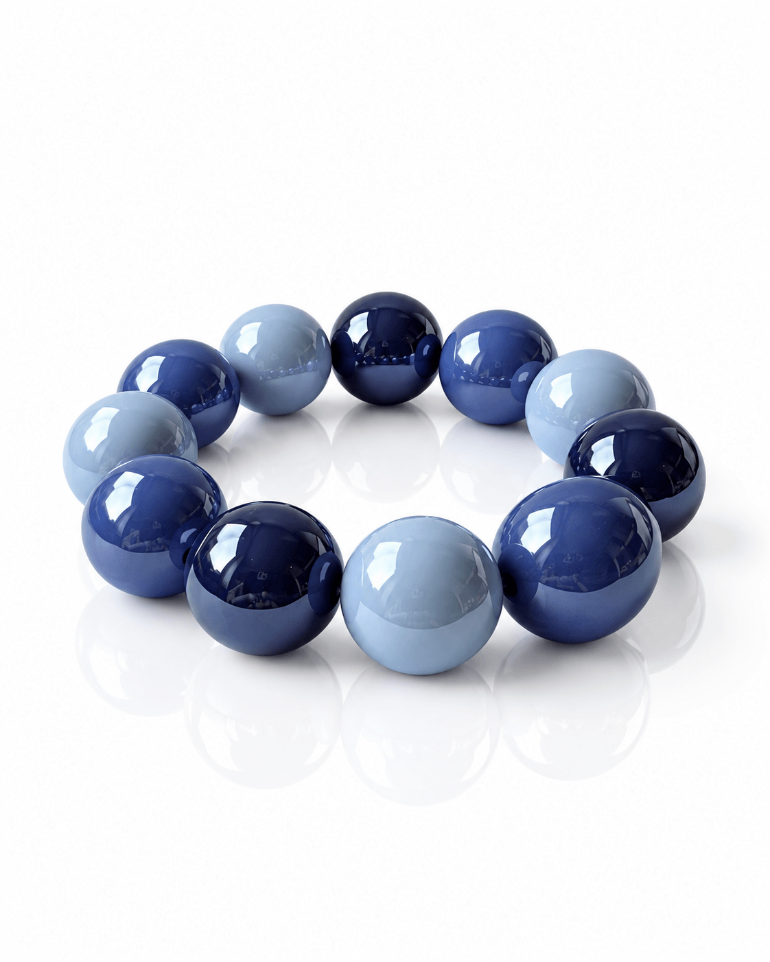 Elastisches THE GLOSSY Armband von CASA Pari mit großen glänzenden Resin-Perlen in verschiedenen Blautönen.